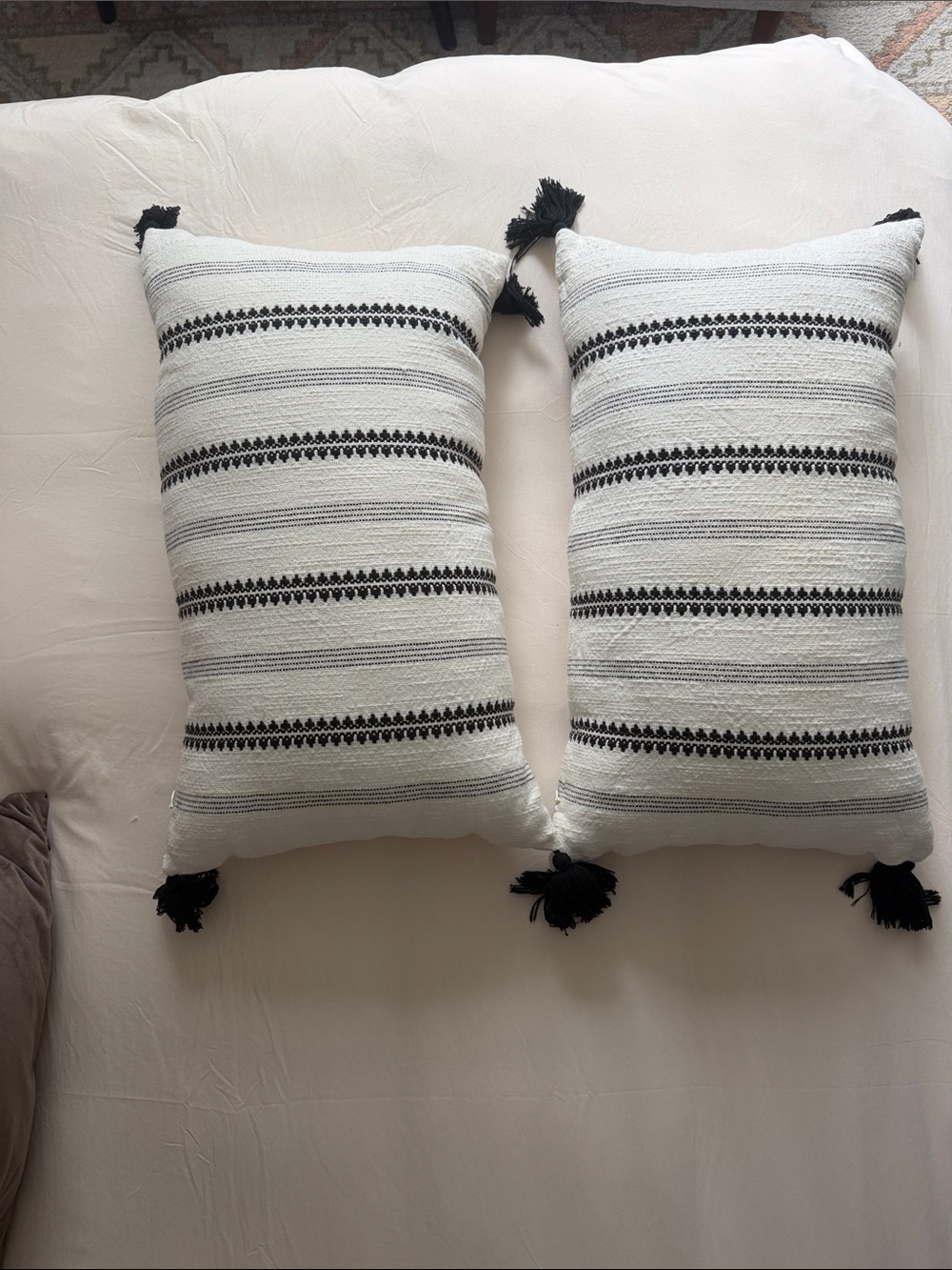 Handwoven Soft Black and White Striped Decorative Throw Pillow with Tassels.